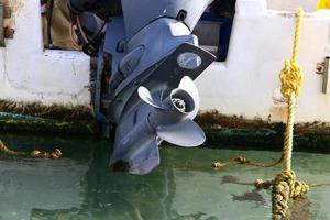 Motor and propeller of a motorboat. photo