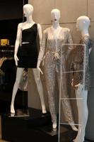 A mannequin stands on a showcase in a store. photo