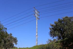 Electric pole and wires carrying high voltage current photo