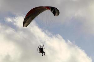 Paragliding in the sky over the Mediterranean Sea. photo