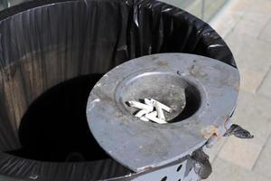 Ashtray - a place for tobacco ash and cigarette butts photo