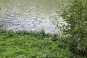 Rome Italy May 9, 2022 Full-flowing river Tiber in the center of Rome. photo