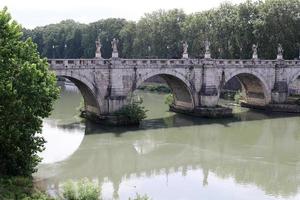 Rome Italy May 9, 2022 Full-flowing river Tiber in the center of Rome. photo