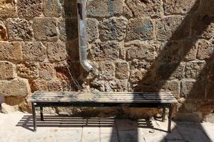 Bench in a city park on the Mediterranean coast photo