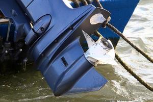 Motor and propeller of a motorboat. photo