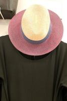 A mannequin stands on a showcase in a large store. photo