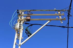 Electric pole and wires carrying high voltage current photo