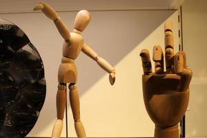 A mannequin stands on a showcase in a store. photo