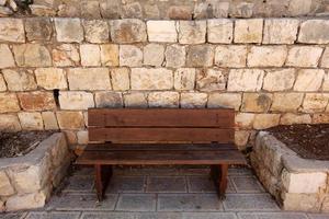 Bench in a city park on the Mediterranean coast photo