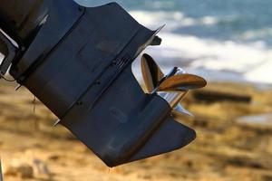 Motor and propeller of a motorboat. photo