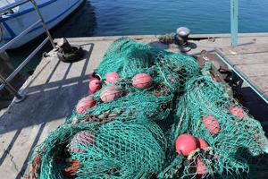 Fishing nets dry on the seashore. photo