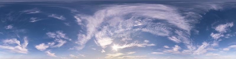 blue sky with beautiful fluffy cumulus clouds. Seamless hdri panorama 360 degrees angle view without ground for use in 3d graphics or game development as sky dome or edit drone shot photo