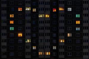 flat night panorama of multicolor heart light in windows of multistory buildings as concept for a couple in love photo