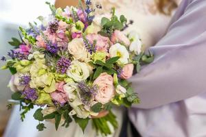 bright wedding bouquet of summer white pink roses and orchid with violet wildflowers photo