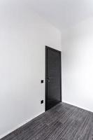 black wooden door in dark style color for modern interior and apartments flat or office photo