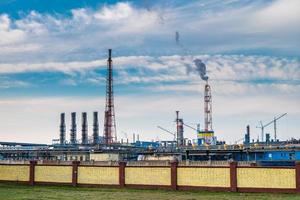 pipes of a chemical enterprise plant. Air pollution concept. Industrial landscape environmental pollution waste of thermal power plant photo