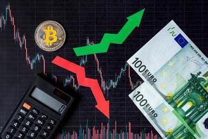 fluctuations  and forecasting of exchange rates of virtual money. Red and green arrows with golden Bitcoin ladder on black paper forex chart background with euro banknotes. Cryptocurrency concept. photo