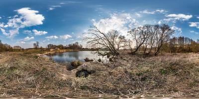 full seamless spherical panorama 360 degrees angle view on the shore of lake in village in evening with beautiful clouds in equirectangular projection, ready VR AR virtual reality content photo