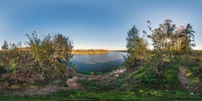 full seamless spherical cube panorama 360 by 180 degrees angle view on precipice of a wide river in sunny summer evening in equirectangular projection, ready for AR VR virtual reality content photo