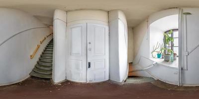 full seamless spherical hdri panorama 360 degrees angle view in interior of white mpty corridor with spiral staircase in equirectangular projection. VR content photo