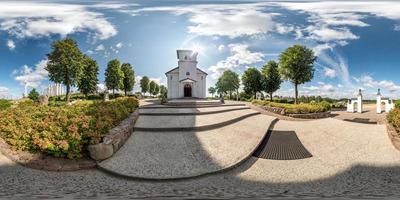 Full seamless hdri panorama 360 degrees angle view facade of church in beautiful decorative medieval  style architecture with concrete stairs in equirectangular spherical projection. vr content photo