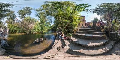 VILNIUS, LITHUANIA  SEPTEMBER 2018, Full seamless 360 degrees angle view panorama on concrete steps near river and place of power in Uzupio country in equirectangular spherical projection. vr content photo