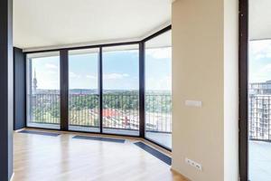 Modern white empty loft apartment interior with parquet floor and panoramic windows, Overlooking the metropolis city photo