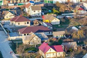 Panoramic view on village building area urban development residential quarter in the evening from a bird's eye view photo