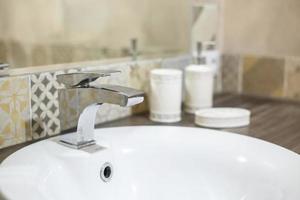 Water tap sink with faucet in expensive loft bathroom photo