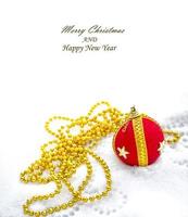 Christmas decoration. Festive Christmas card. Toy ball in the snow. photo