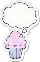 cartoon cupcake with face and thought bubble as a distressed worn sticker vector