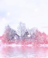 Village in winter snow covered forest. Holiday card. photo