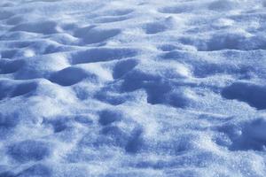 antecedentes. paisaje de invierno la textura de la nieve foto