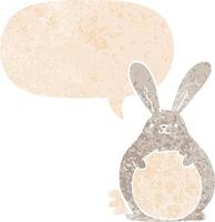 cartoon rabbit and speech bubble in retro textured style vector