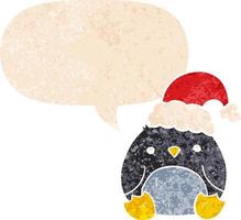 lindo pingüino de dibujos animados con sombrero de navidad y burbuja de habla en estilo retro texturizado vector