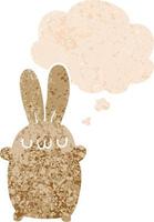 cartoon rabbit and thought bubble in retro textured style vector