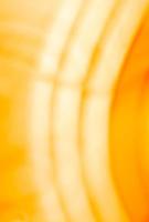 Vertical yellow orange background with glowing arcs. Abstraction photo