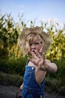 Little blonde girl playing on countryside photo