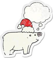 cartoon bear wearing christmas hat and thought bubble as a distressed worn sticker vector