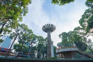 Wide angle view of Lotus pillar - An iconic architecture at Turtle lake , Ho Con Rua with blue sky in Saigon. photo