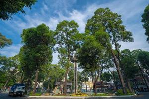 Wide angle view of Lotus pillar - An iconic architecture at Turtle lake , Ho Con Rua with blue sky in Saigon. photo