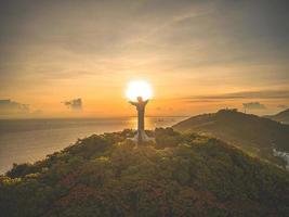 Top view of Vung Tau with silhouette statue of Jesus Christ on Mountain . the most popular local place. Christ the King, a statue of Jesus. Travel concept. photo