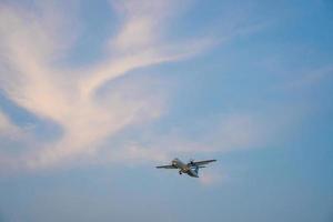 Ho Chi Minh city, Vietnam - FEB 20 2022 Airplane fly over urban areas preparing landing into Tan Son Nhat International Airport and takes off in TSN airport photo