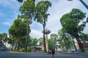 Wide angle view of Lotus pillar - An iconic architecture at Turtle lake , Ho Con Rua with blue sky in Saigon. photo