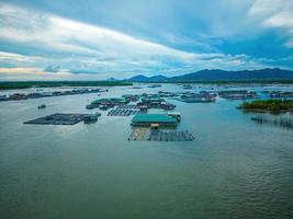 A corner of the oyster feeding farm, float fishing village in Long Son commune, Ba Ria Vung Tau province Vietnam. People living and doing feed fish industry at floating village. photo