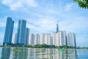 Ho Chi Minh city, VIETNAM - 12 FEB 2022 Beautiful blue sky view at Landmark 81 is a super tall skyscraper in center Ho Chi Minh City, Vietnam and Saigon bridge with development buildings photo