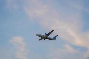 Ho Chi Minh city, Vietnam - FEB 20 2022 Airplane fly over urban areas preparing landing into Tan Son Nhat International Airport and takes off in TSN airport photo