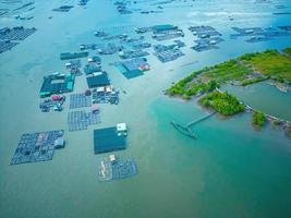 A corner of the oyster feeding farm, float fishing village in Long Son commune, Ba Ria Vung Tau province Vietnam. People living and doing feed fish industry at floating village. photo