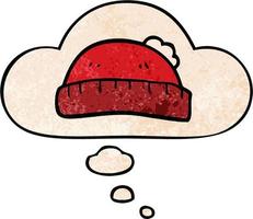 cartoon woolly hat and thought bubble in grunge texture pattern style vector