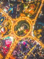 Vung Tau view from above, with traffic roundabout, house, Vietnam war memorial in Vietnam. Long exposure photography at night. photo